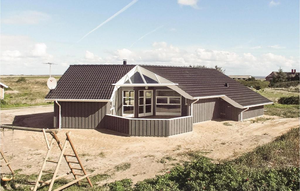 a house is being built in the dirt at Cozy Home In Hvide Sande With Kitchen in Havrvig