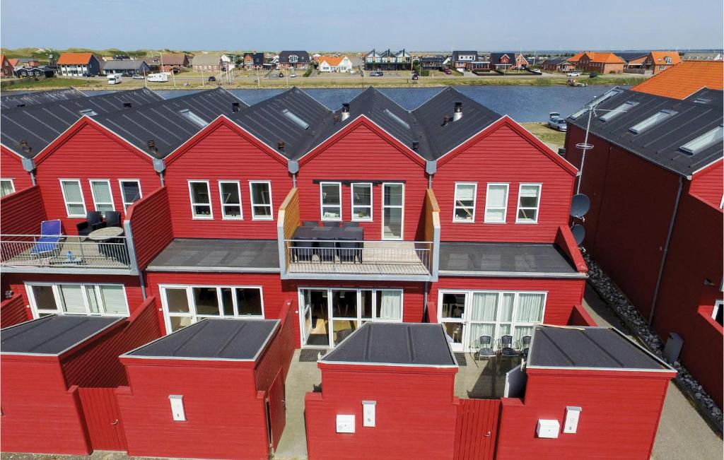 an aerial view of red houses in a harbor at Beautiful Home In Ulfborg With House Sea View in Thorsminde
