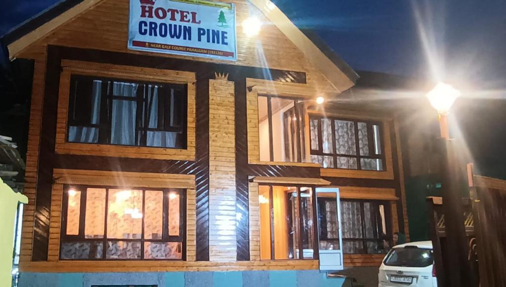 a building with a sign that reads hotel crown prince at Hotel Crown Pine Pahalgam in Anantnāg