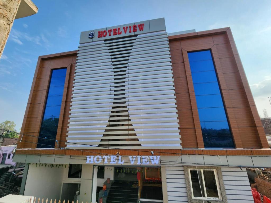 a building with a hotel on top of it at HOTEL VIEW in Govardhan