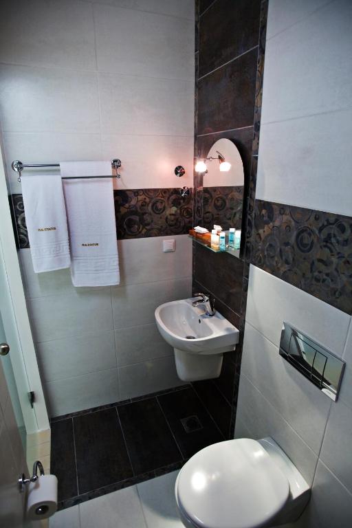 Koupelna v ubytování Rg Status Hotel