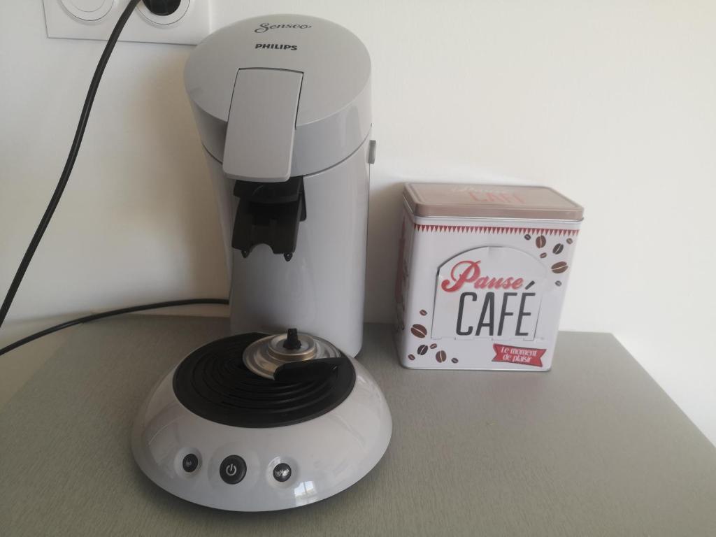 a white blender sitting next to a box of coffee at Chez Mélanie in Marseille