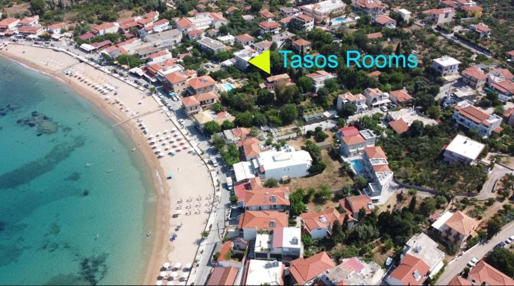 an aerial view of a beach and the ocean at Tasos Rooms in Stoupa