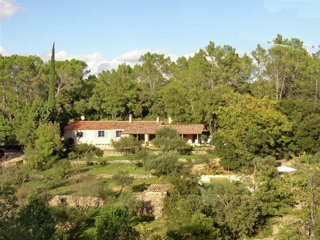 an aerial view of a house in the woods at Tranquil holiday home in Carc s with private pool in Carcès