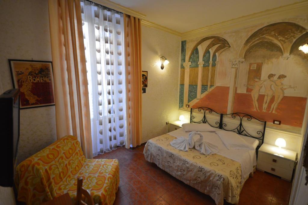 Postel nebo postele na pokoji v ubytování Hotel Alexis