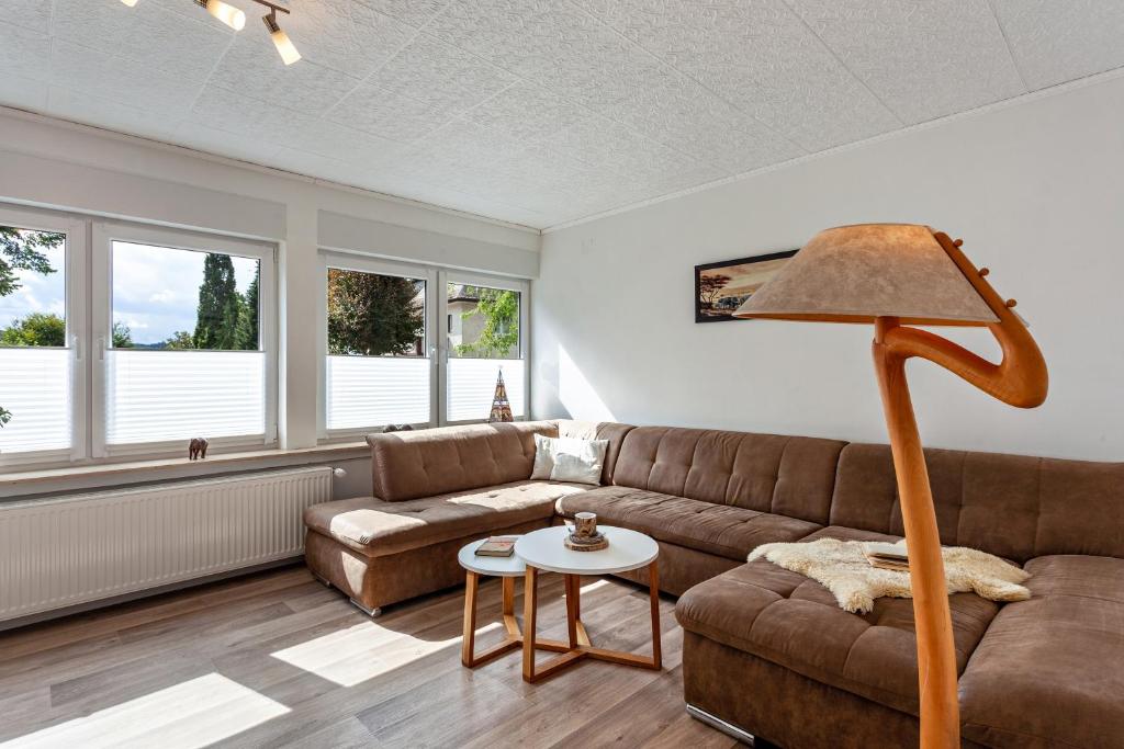 a living room with a couch and a table at Elim in Olsberg