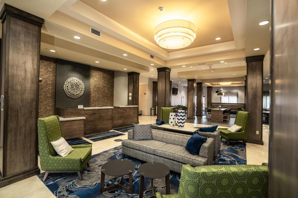 a lobby with a couch and chairs and a waiting room at Fairfield Inn & Suites by Marriott Kearney in Kearney