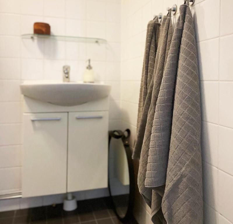 a bathroom with a sink and a white sink at Holiday apartment in Storvik close to skiing and fishing in Storvik