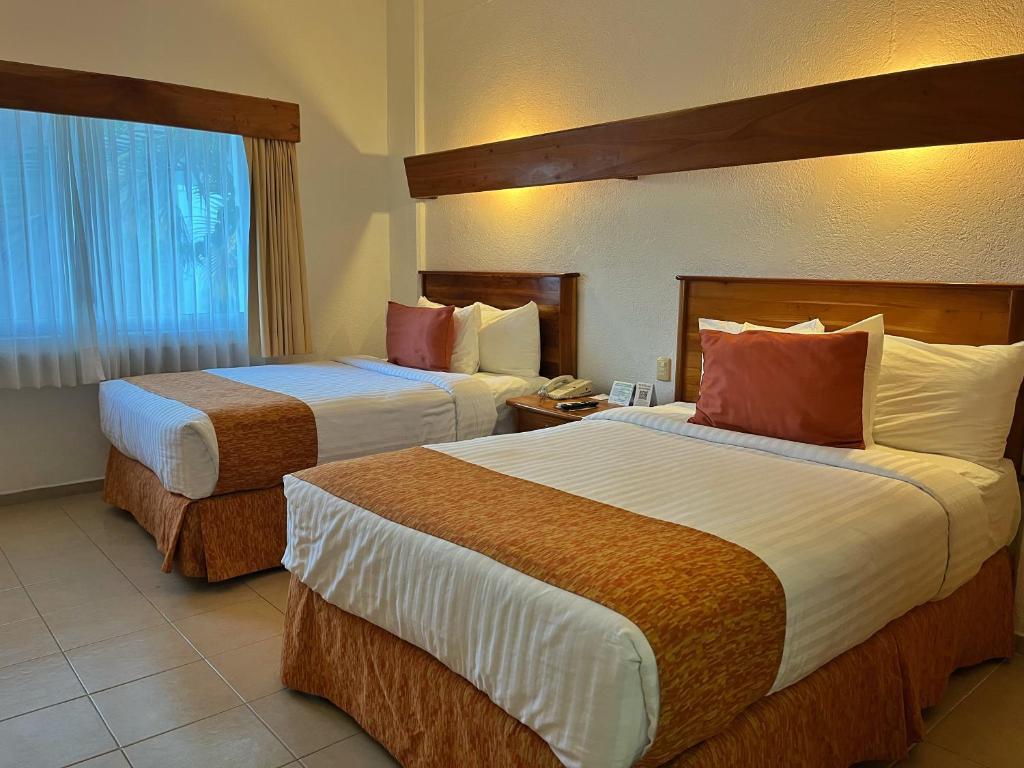 Postel nebo postele na pokoji v ubytování Best Western Riviera Tuxpan