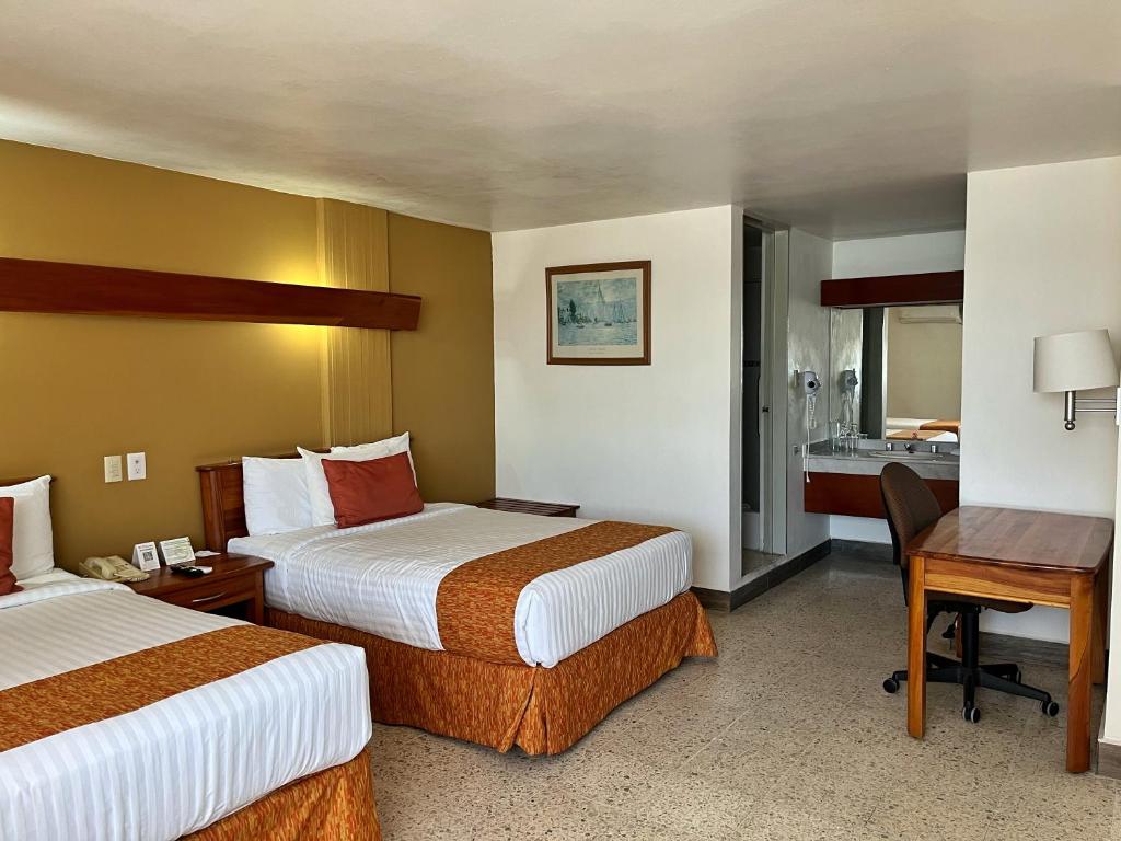 Postel nebo postele na pokoji v ubytování Best Western Riviera Tuxpan
