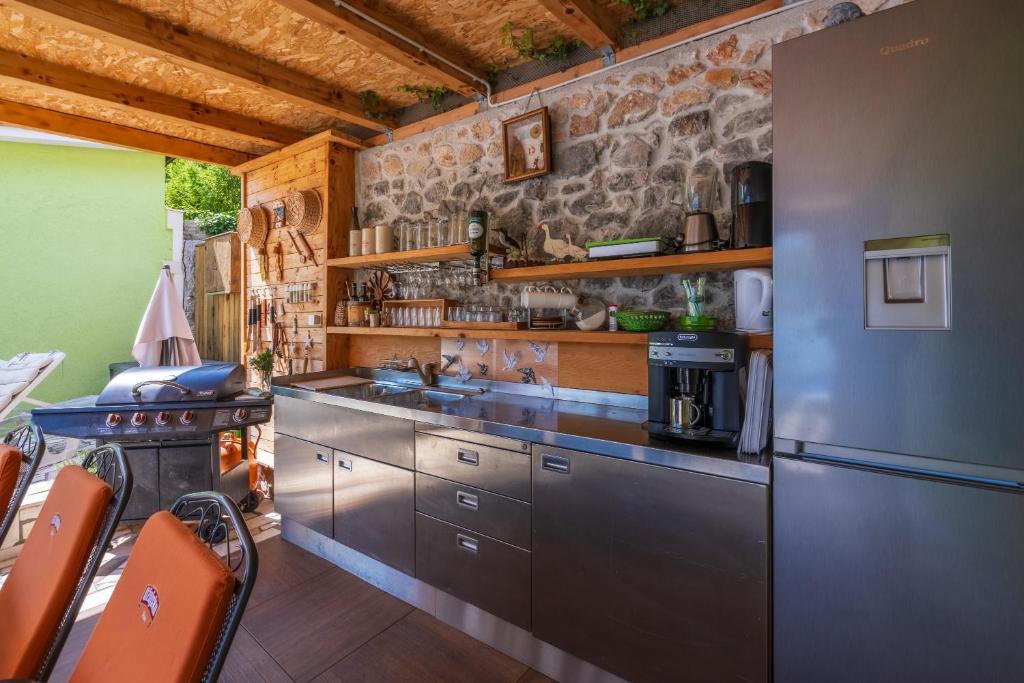 Kuchyň nebo kuchyňský kout v ubytování Greenhouse Adria