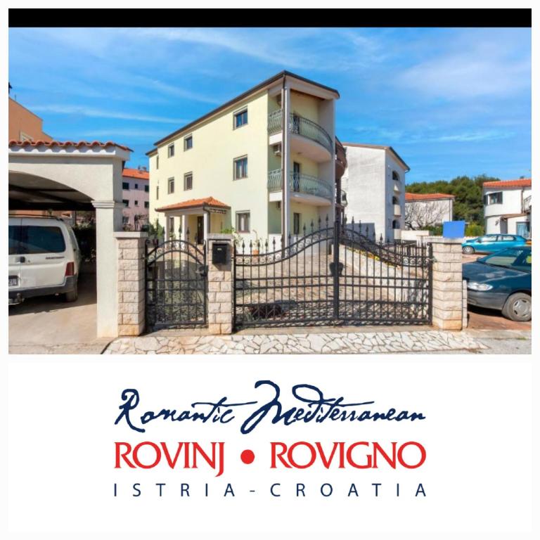 a villa with a gate in front of a building at Villa Mara in Rovinj