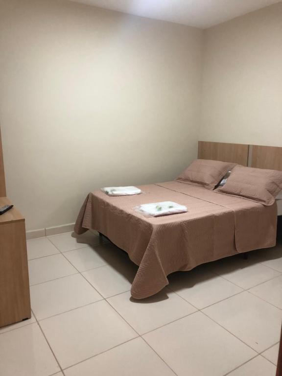Postel nebo postele na pokoji v ubytování Attriun Hotel
