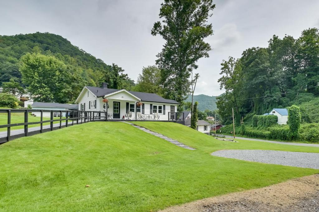 a house with a large yard with a fence at Mullens Home - Close to Hatfield-McCoy Trailhead! in Mullens