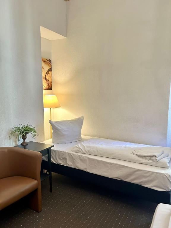 Postel nebo postele na pokoji v ubytování Hotel Adam