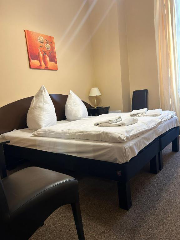 Postel nebo postele na pokoji v ubytování Hotel Adam