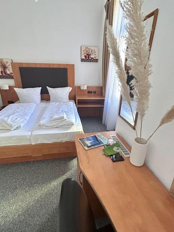 Postel nebo postele na pokoji v ubytování Hotel Adam