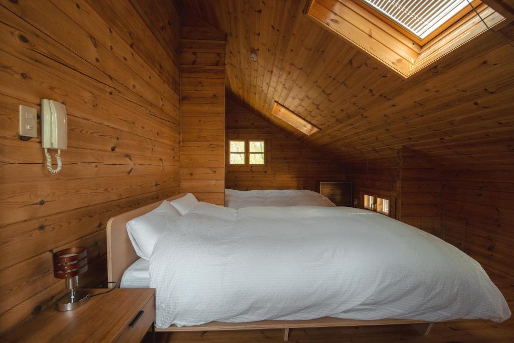 Postel nebo postele na pokoji v ubytování The Lodge Teshikaga
