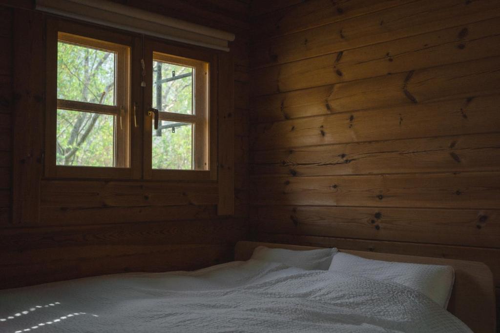 Postel nebo postele na pokoji v ubytování The Lodge Teshikaga