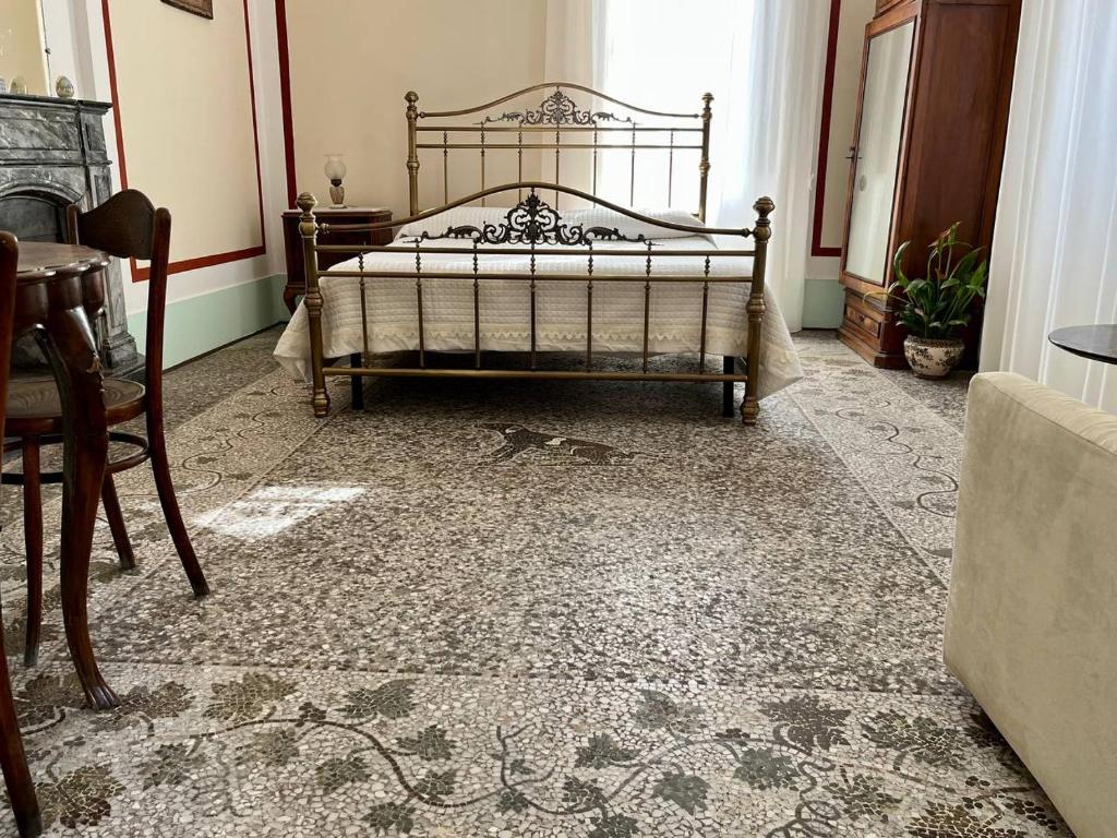 Giường trong phòng chung tại LA CASA DEL MOSAICO