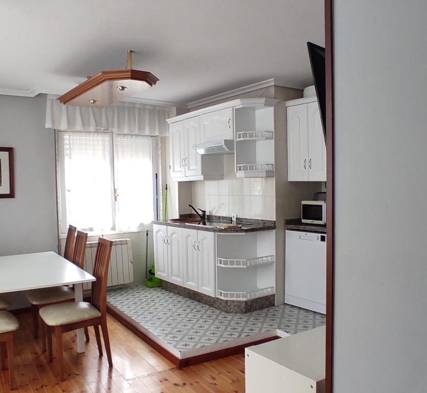 A kitchen or kitchenette at Apartamentos El Jornu