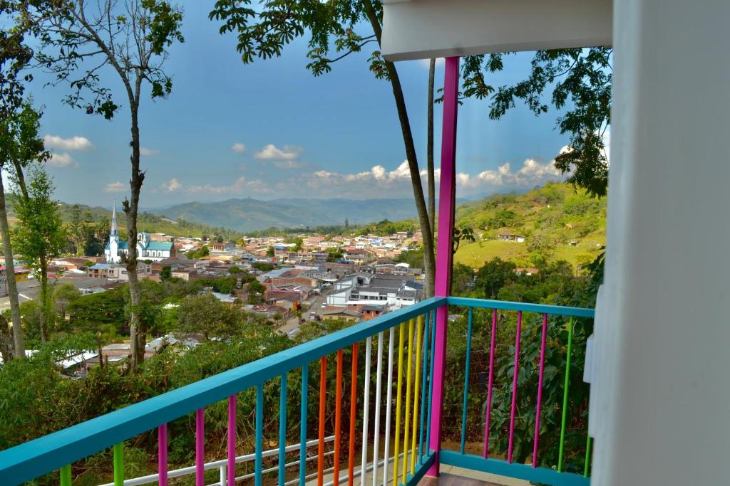 a balcony with a view of a town at Casa del Bosque in Trujillo