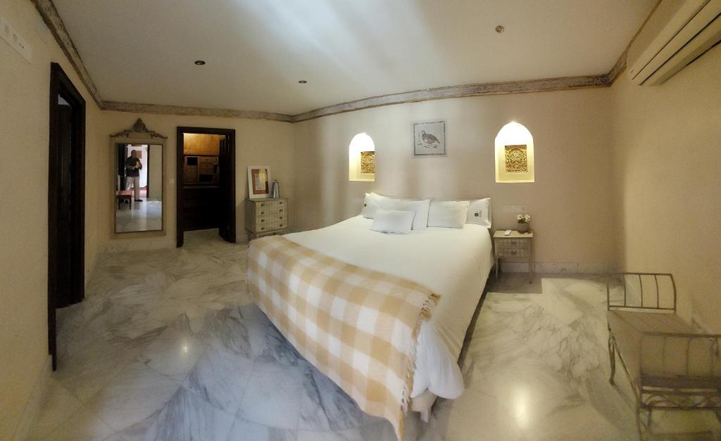 Posteľ alebo postele v izbe v ubytovaní La casa del Cipres una casa con historia