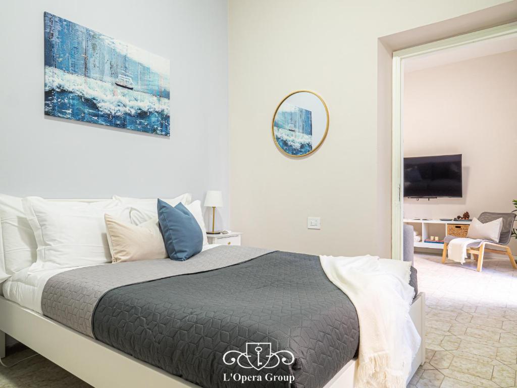 Postel nebo postele na pokoji v ubytování Casa MaNa - L'Opera Group