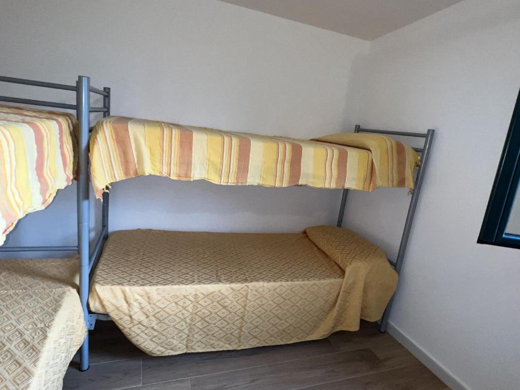 A bed or beds in a room at Casa Chia a 5 minuti dal mare - Su Giudeu Tuerredda