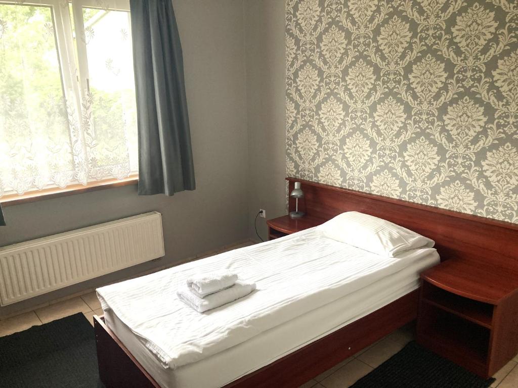 Postel nebo postele na pokoji v ubytování Hotel Ava