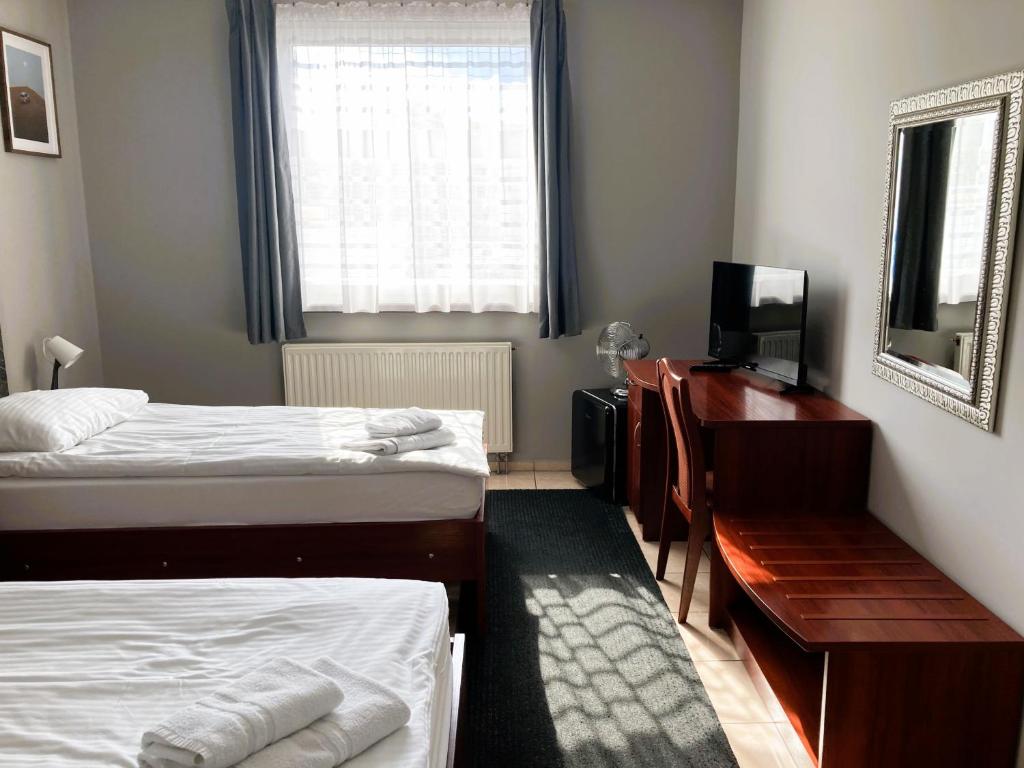 Postel nebo postele na pokoji v ubytování Hotel Ava