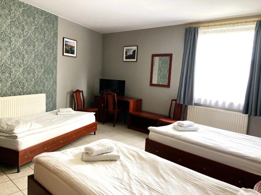 Postel nebo postele na pokoji v ubytování Hotel Ava