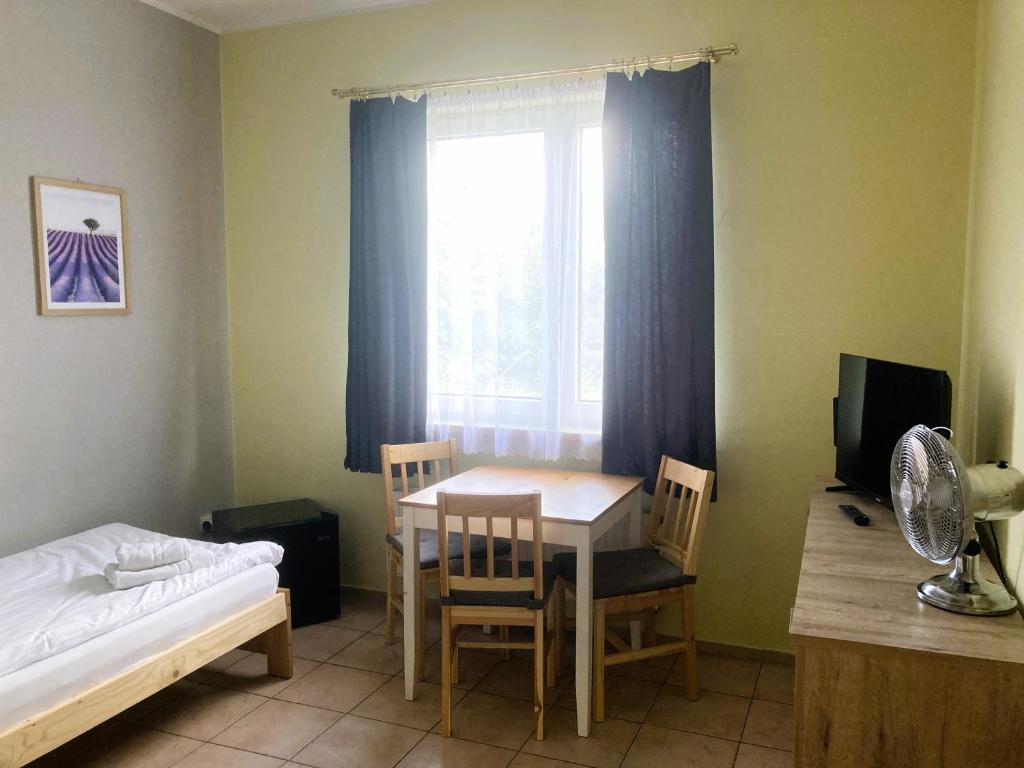 Postel nebo postele na pokoji v ubytování Hotel Ava