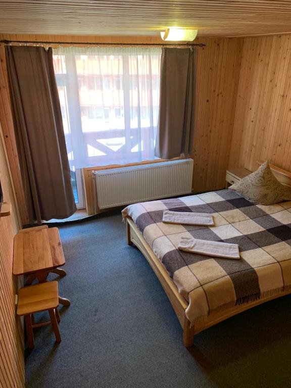 Postel nebo postele na pokoji v ubytování Hotel Novoe Shale
