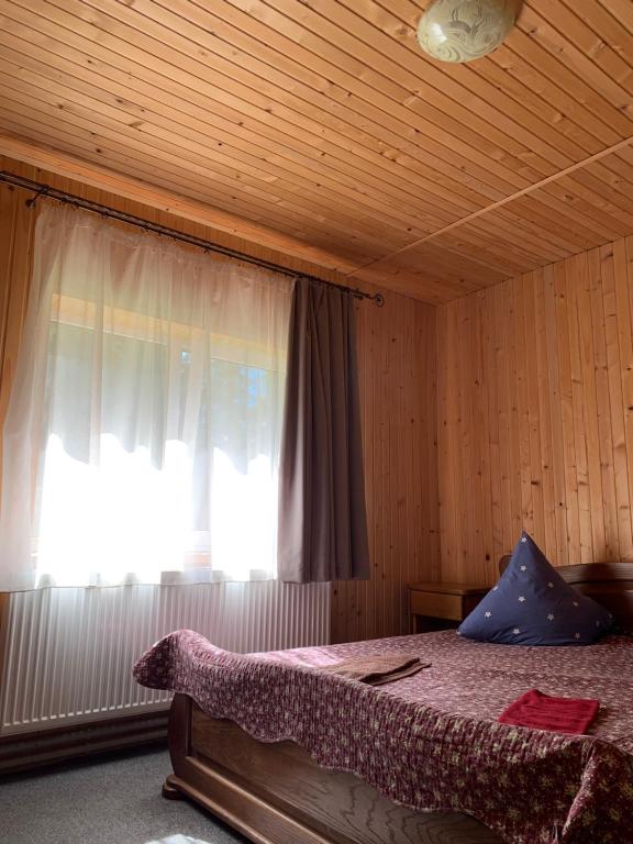 Postel nebo postele na pokoji v ubytování Hotel Novoe Shale