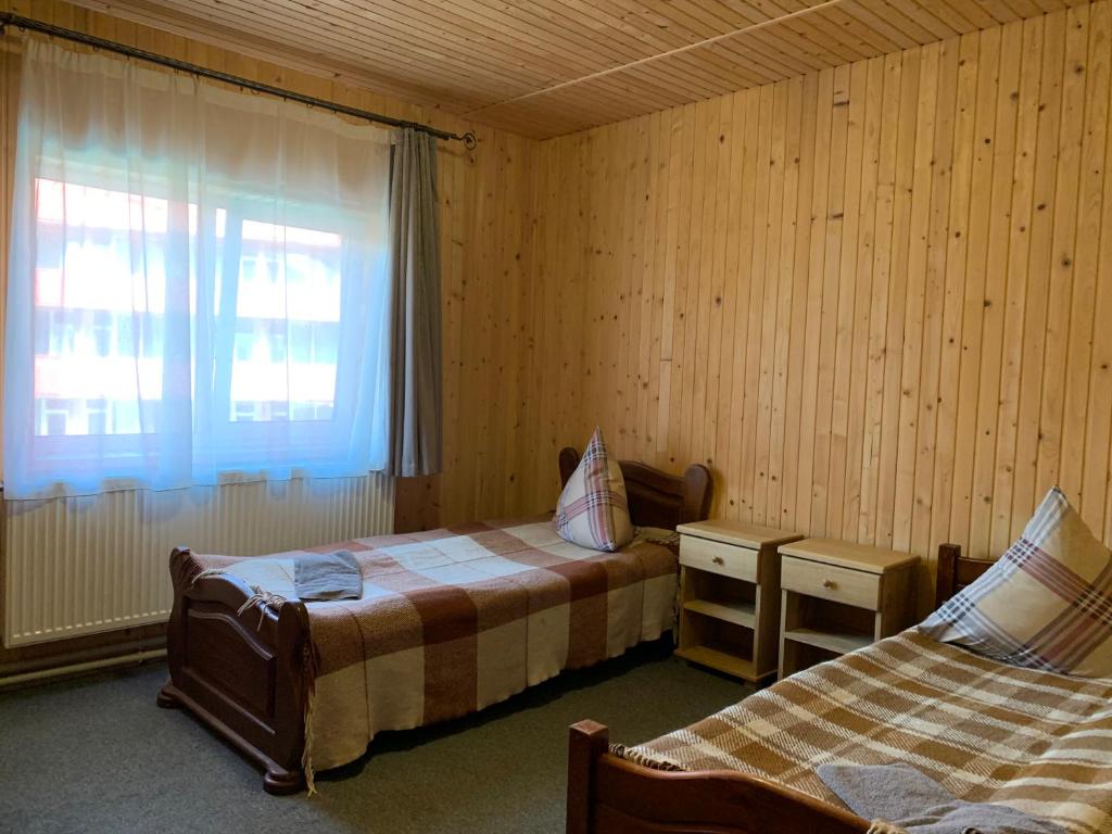 Postel nebo postele na pokoji v ubytování Hotel Novoe Shale