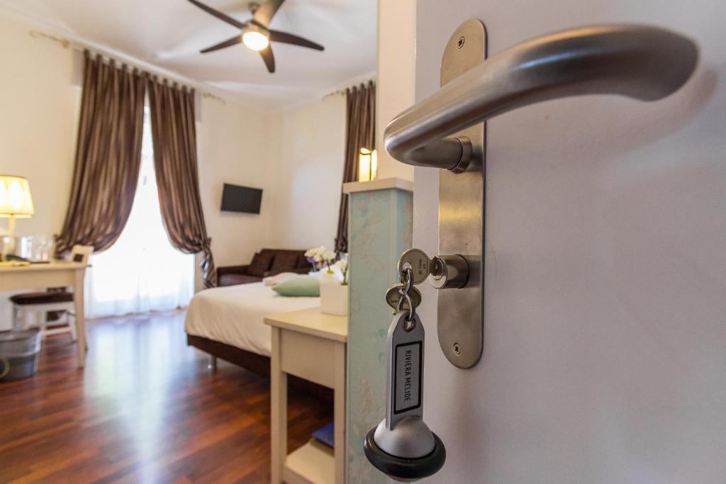 Postel nebo postele na pokoji v ubytování Hotel Riviera
