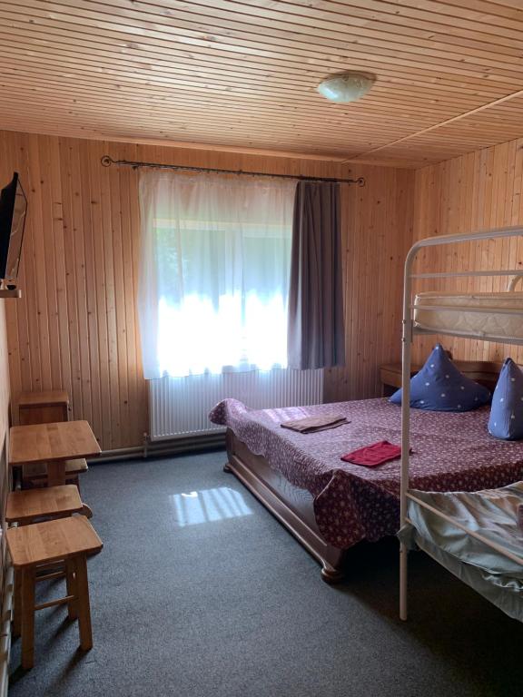 Postel nebo postele na pokoji v ubytování Hotel Novoe Shale