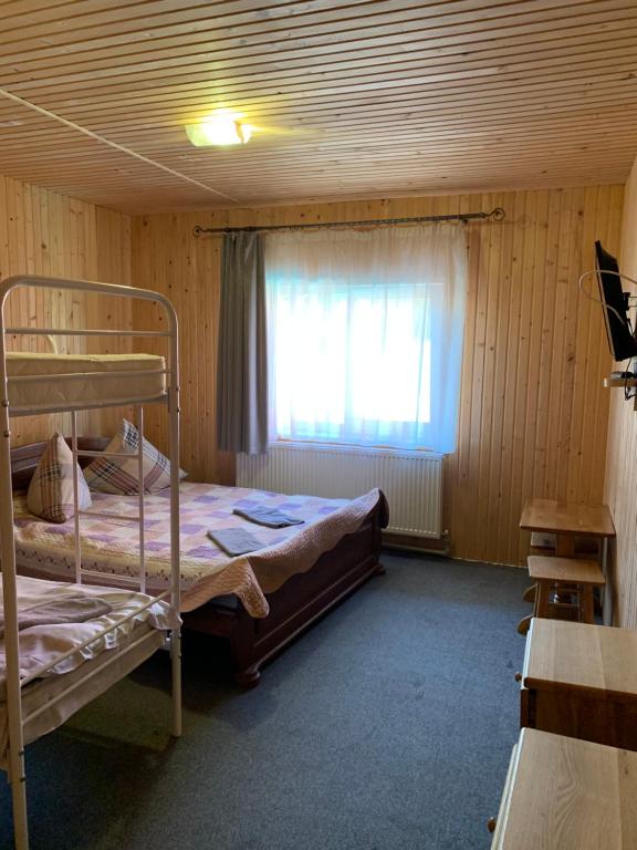 Postel nebo postele na pokoji v ubytování Hotel Novoe Shale