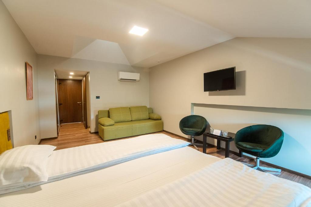 Postel nebo postele na pokoji v ubytování HOTEL VITAL