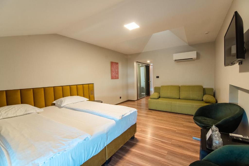 Postel nebo postele na pokoji v ubytování HOTEL VITAL
