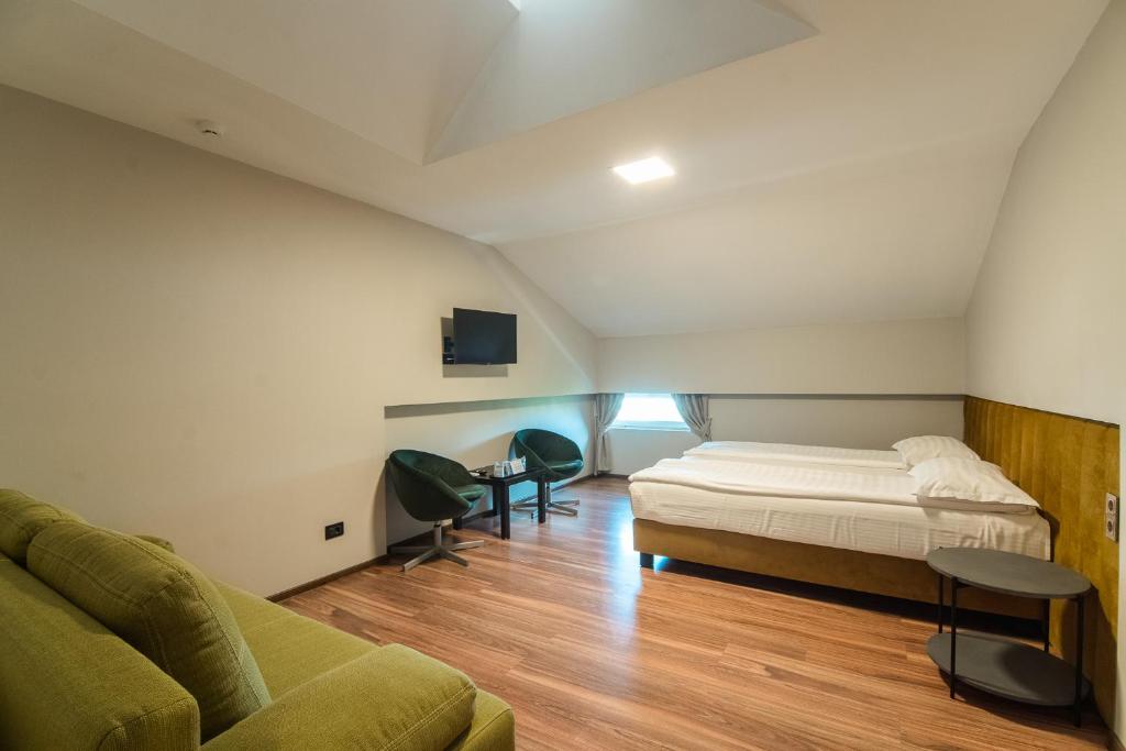 Postel nebo postele na pokoji v ubytování HOTEL VITAL