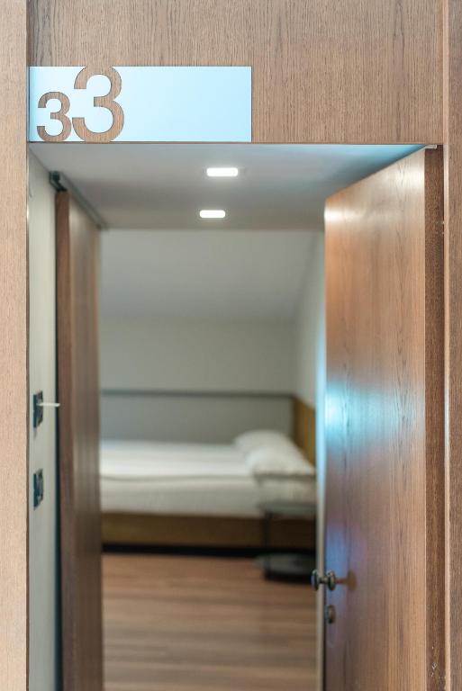 Postel nebo postele na pokoji v ubytování HOTEL VITAL