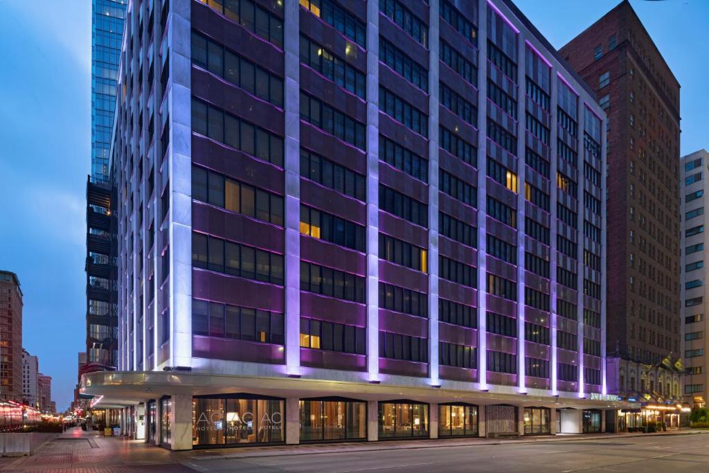 a purple building in the city at night at AC Hotel by Marriott Houston Downtown in Houston