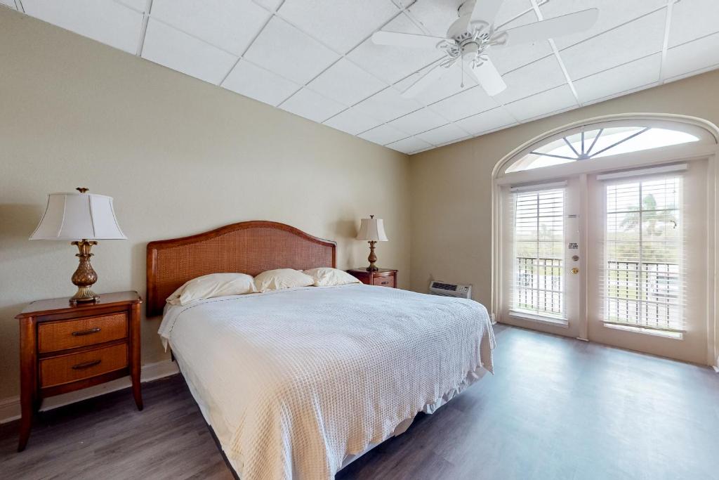 a bedroom with a bed and a ceiling fan at Port of the Islands M258 in Naples