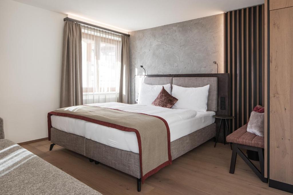 Postel nebo postele na pokoji v ubytování Hotel Salzburg