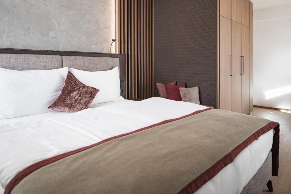 Postel nebo postele na pokoji v ubytování Hotel Salzburg