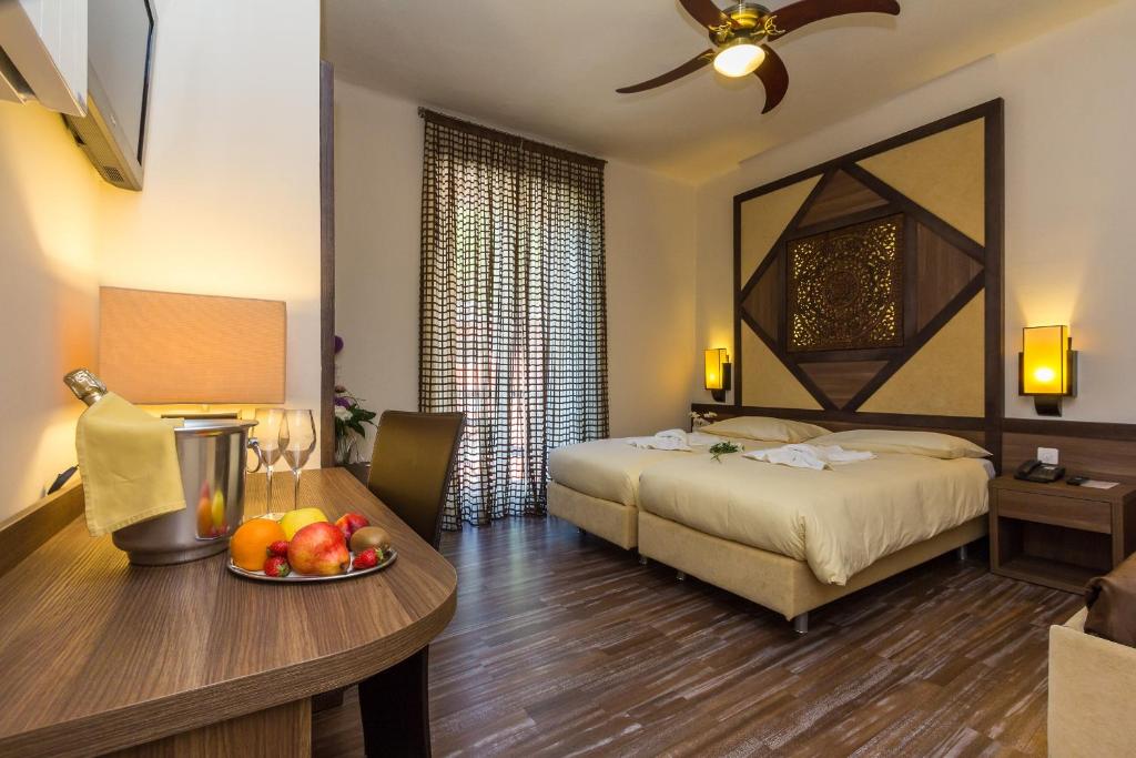 Postel nebo postele na pokoji v ubytování Hotel Riviera