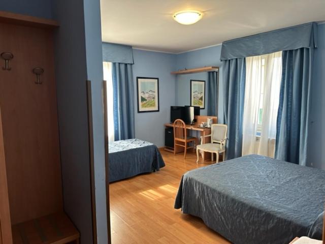 Postel nebo postele na pokoji v ubytování Hotel L'Isola