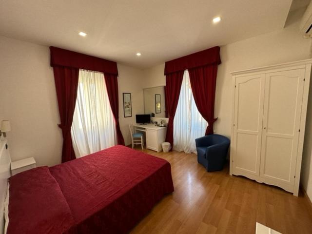 Postel nebo postele na pokoji v ubytování Hotel L'Isola